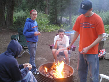 Cooking hotdogs over an open fire for dinner