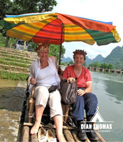 Dian Thomas takes a bamboo boat and go down the river in China
