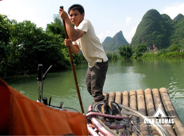 Our eager Chinese boatman takes us on a boat ride down the river