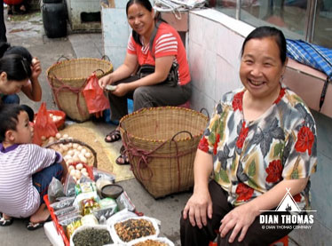 Lady selling spices at the Chinese farmers market