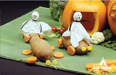 Use other vegetables to create props for a spooky Halloween pumpkin village.