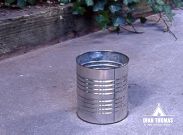 A #10-size tin can will make an easy and economical grill.